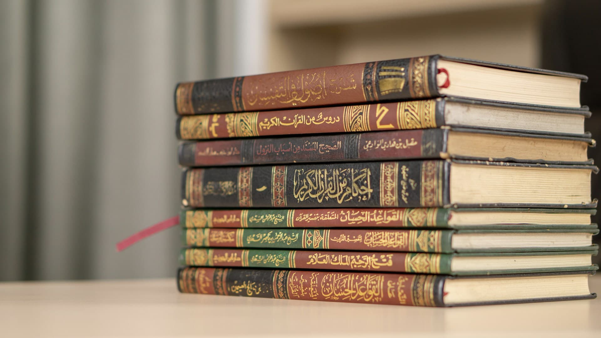 Scholar holding Islamic books